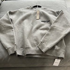 FEAR OF GOD ESSENTIALS CREWNECK - DARK OATMEAL
FEAR OF GOD ESSENTIALS